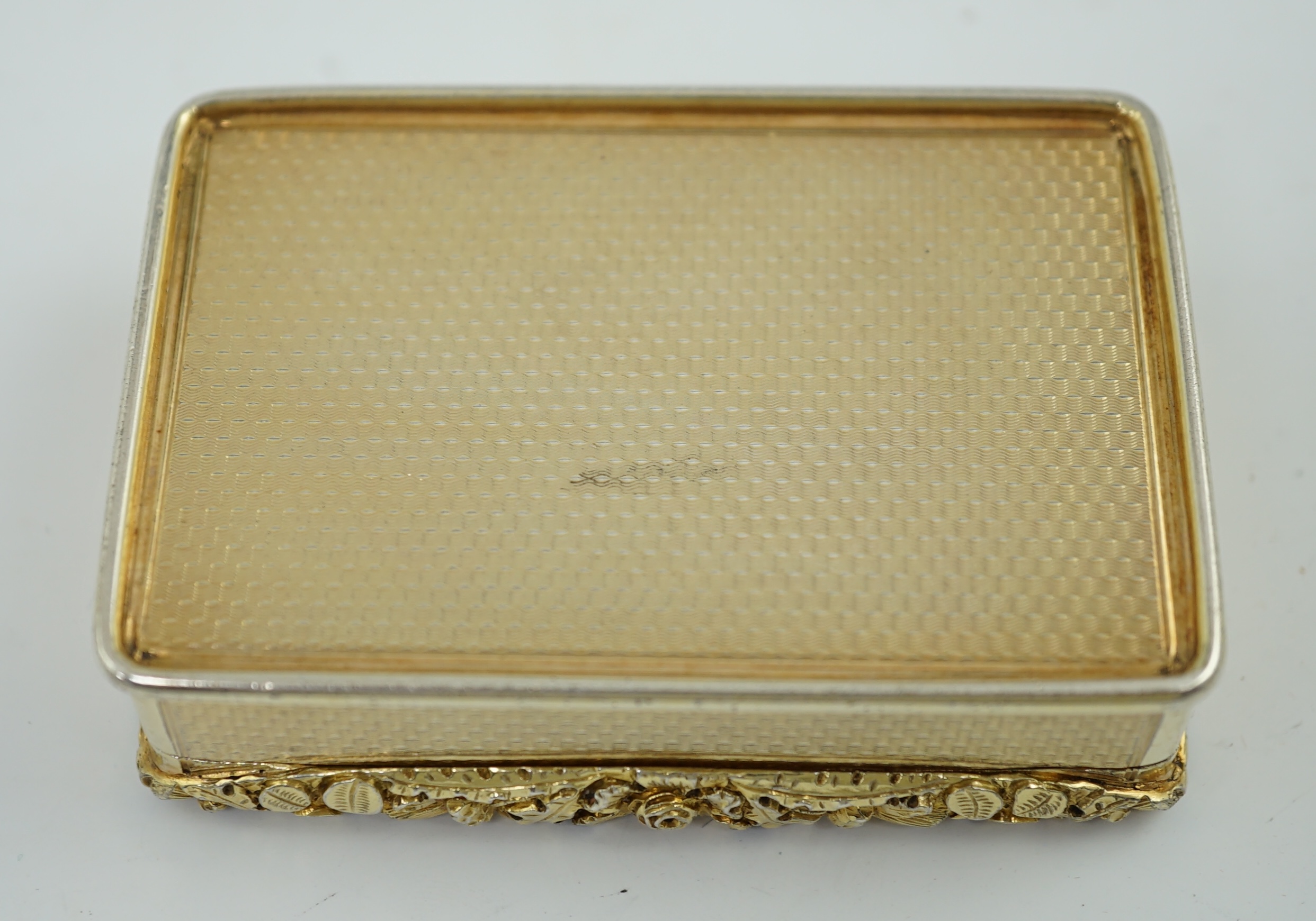 A late George III engine turned silver gilt rectangular snuff box, by William Snooke Hall